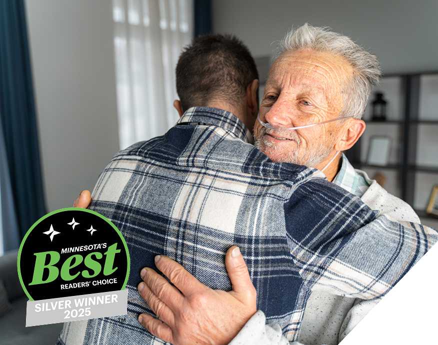 elderly-man-and-adult-son-hugging-minnesotas-best-winner-stamp