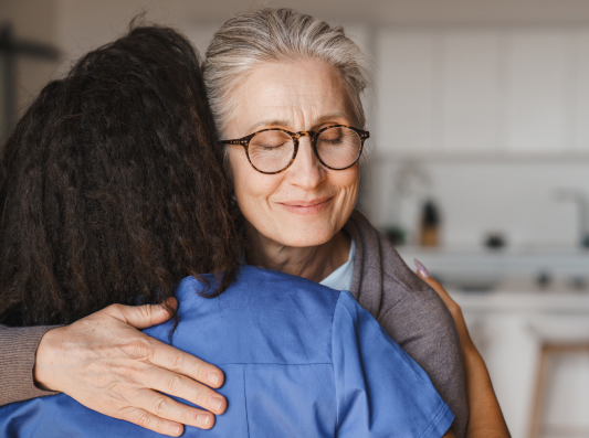 nurse-hugging-adult-woman